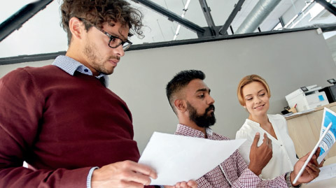 Photo of people reviewing documents