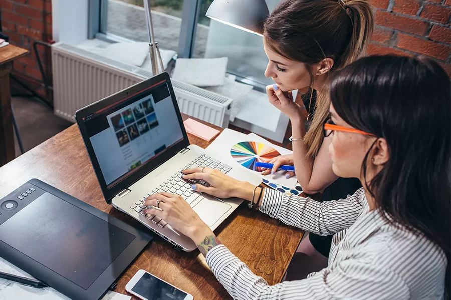 Co-workers creating a web page